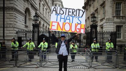 Anti-austerity protester outside Downing Street, 2012