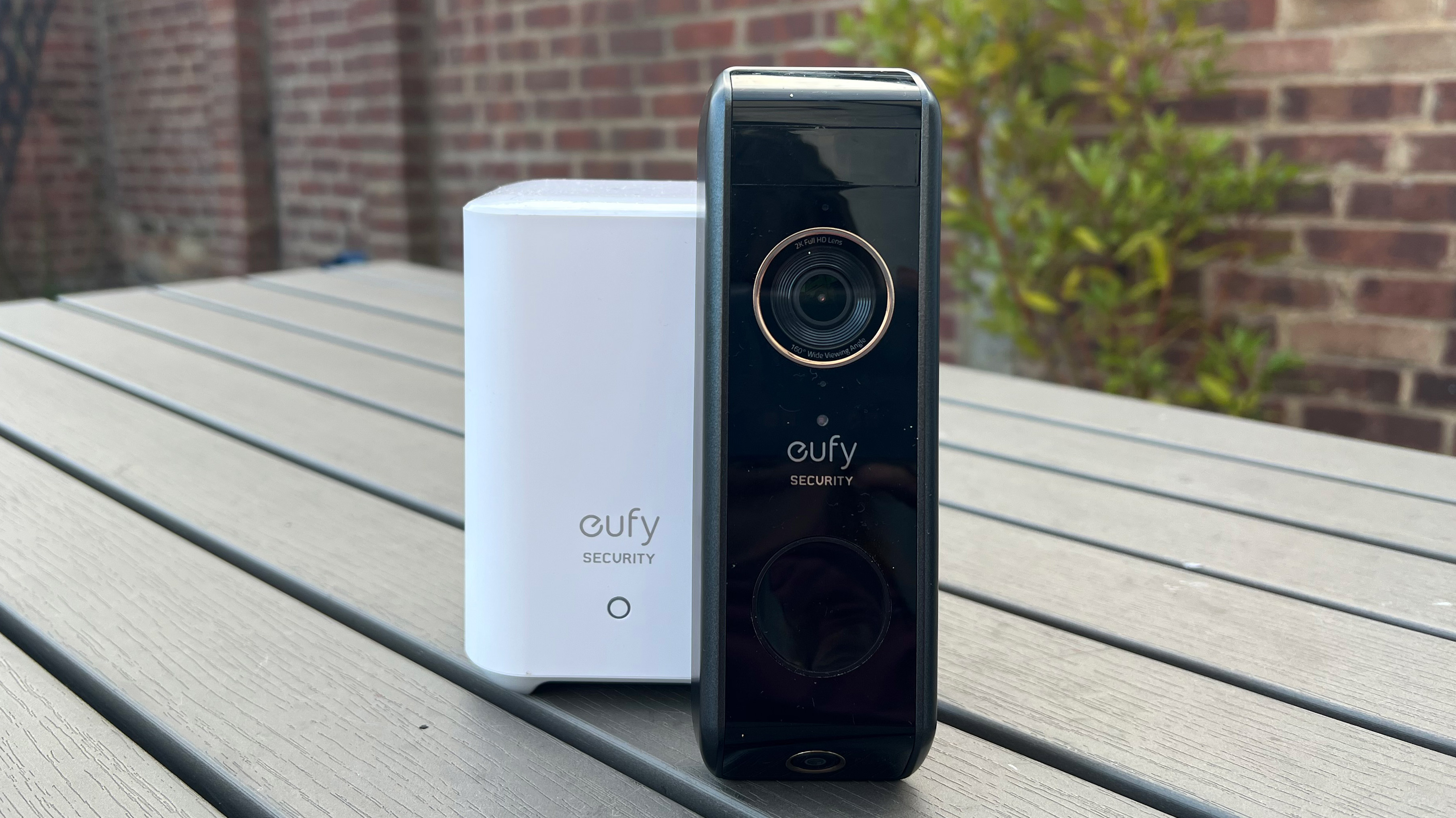 The Eufy Video Doorbell Dual next to the base station