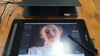 XP-Pen Artist 16 (2nd gen) review; a photo of a woman's face painted on a tablet.