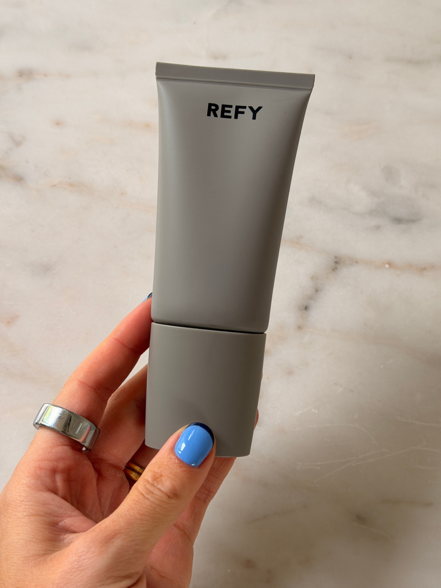 Grace holding the Refy primer