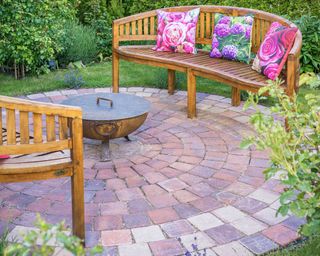 circular paved patio with benches
