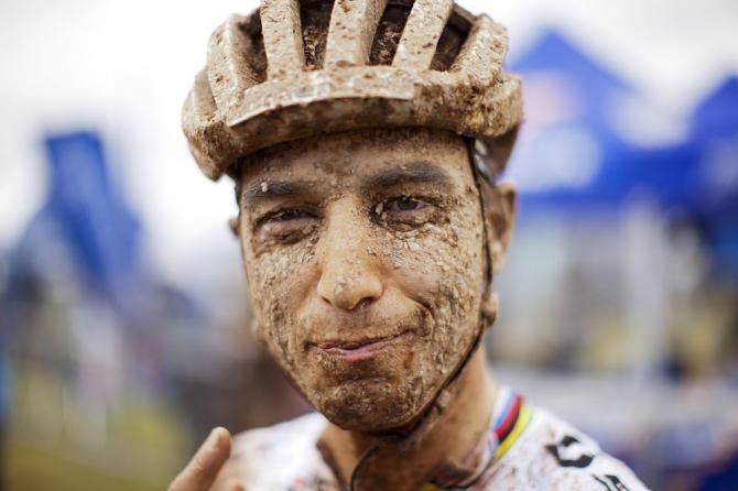 A muddy Nino Schurter, world champion