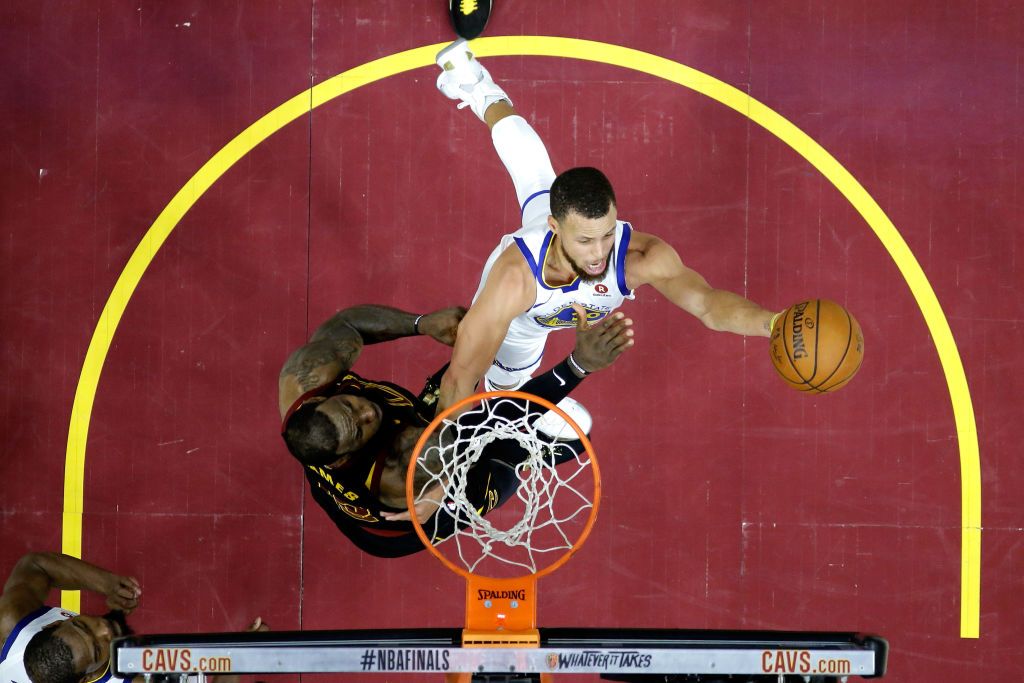 Stephen Curry #30 of the Golden State Warriors drives to the basket in the second half against LeBron James #23 of the Cleveland Cavaliers during Game Four of the 2018 NBA Finals at Quicken L