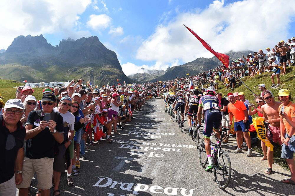 Riders make their way through the crowds.