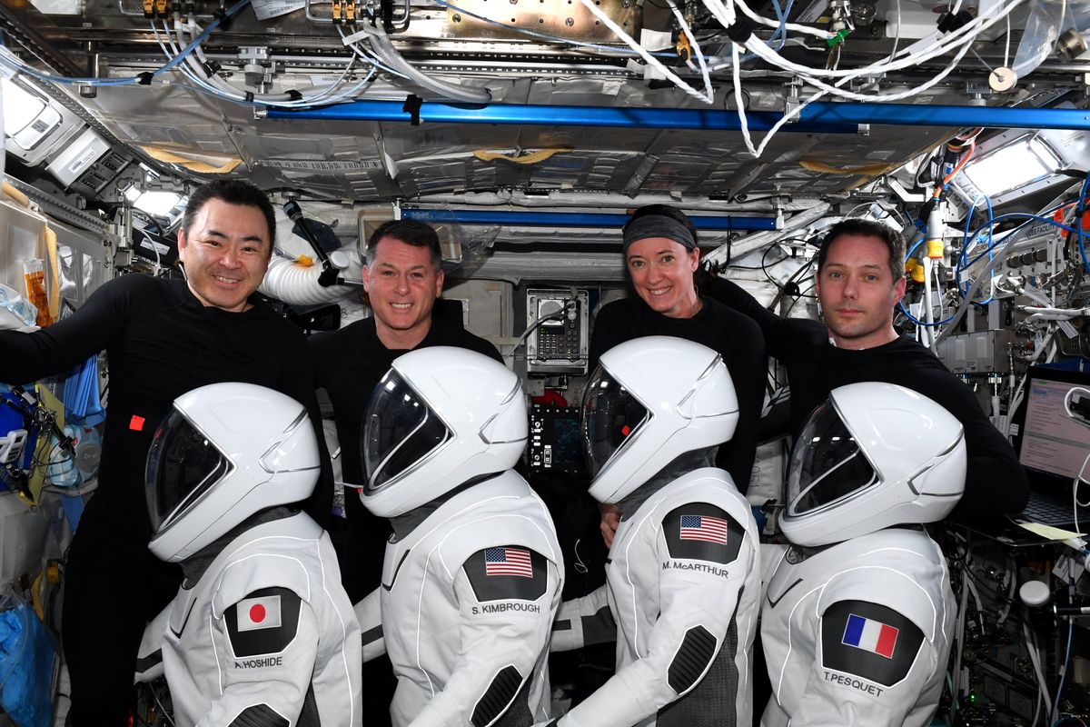 The four astronauts of NASA and SpaceX&#039;s Crew-2 mission pose with their launch and entry suits as they wrap up a six-month mission to the International Space Station. They are: (from left) Akihiko Hoshide of the Japan Aerospace Exploration Agency, Shane Kimbrough and Megan McArthur of NASA and Thomas Pesquet of European Space Agency.