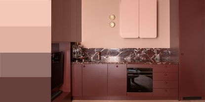 tonal kitchen color with burgundy cabinets, pale pink walls and range, two wall sconces, and burgundy marble backsplash and counter