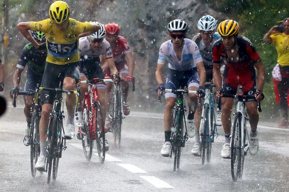The GC group contends with a torrential downpour during stage 9 at the Tour de France.