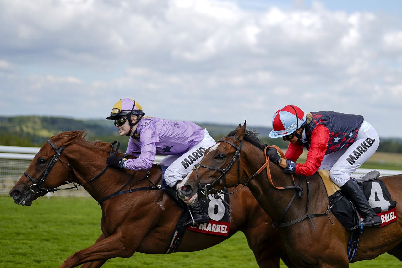 Thea Gosden Hood riding She Got The Jockey (L) dead heat with Candida Crawford riding Mine Behind (R) in The Magnolia Cup during the Qatar Goodwood Festival at Goodwood Racecourse on July 29, 2021 near Chichester.