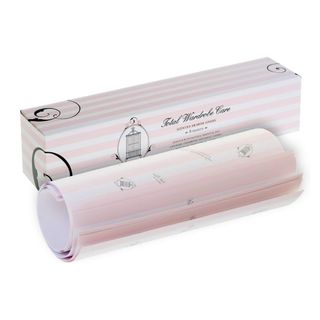 Pink and white striped paper liners rolled up next to a rectangular packaging box