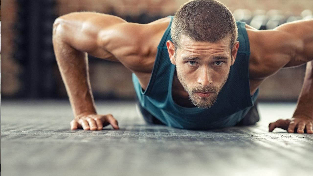 a man performing push ups