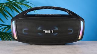 the tribit stormbox blast 2 bluetooth speaker, 18 inches long and weighing 19 pounds, with multicolored LED lights and a carry handle