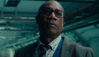 Justice League Joe Morton Dr. Silas Stone worried in one of his lab's corridors