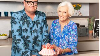 Mary Berry with Alan Carr next to a blancmange pink candle in the kitchen in Alan&#039;s London flat