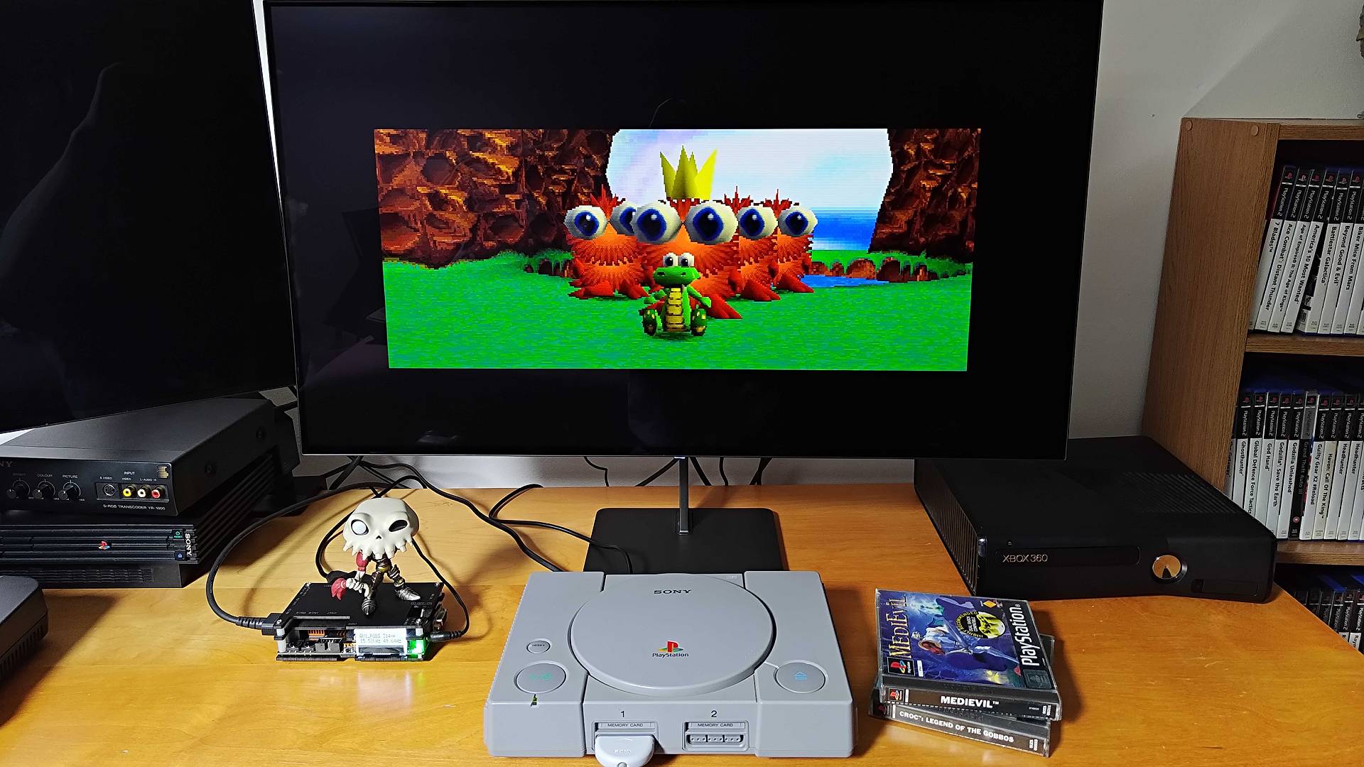 Original PlayStation connected to Dough Spectrum Black monitor via OSSC upscaler playing Croc: Legend of the Gobbos.