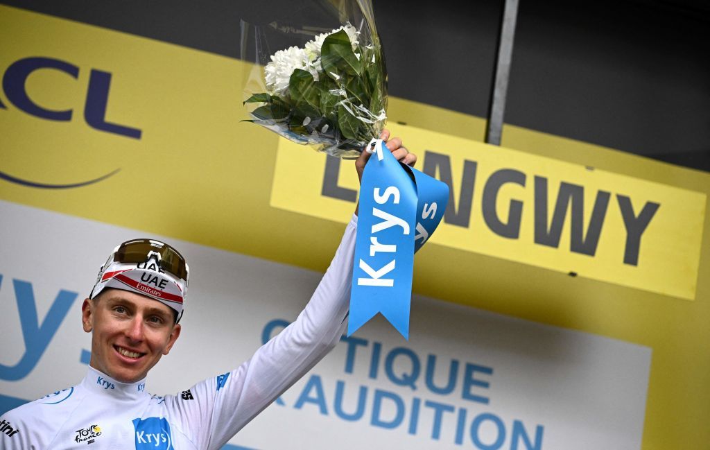 UAE Team Emirates teams Slovenian rider Tadej Pogacar wearing the best young riders white jersey celebrates on the podium after the 6th stage of the 109th edition of the Tour de France cycling race 2199 km between Binche in Belgium and Longwy in northern France on July 7 2022 Photo by Marco BERTORELLO AFP Photo by MARCO BERTORELLOAFP via Getty Images