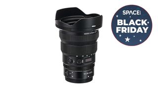 A NIKKOR Z 14-24mm f/2.8 S camera lens, pointed upright with black friday badge
