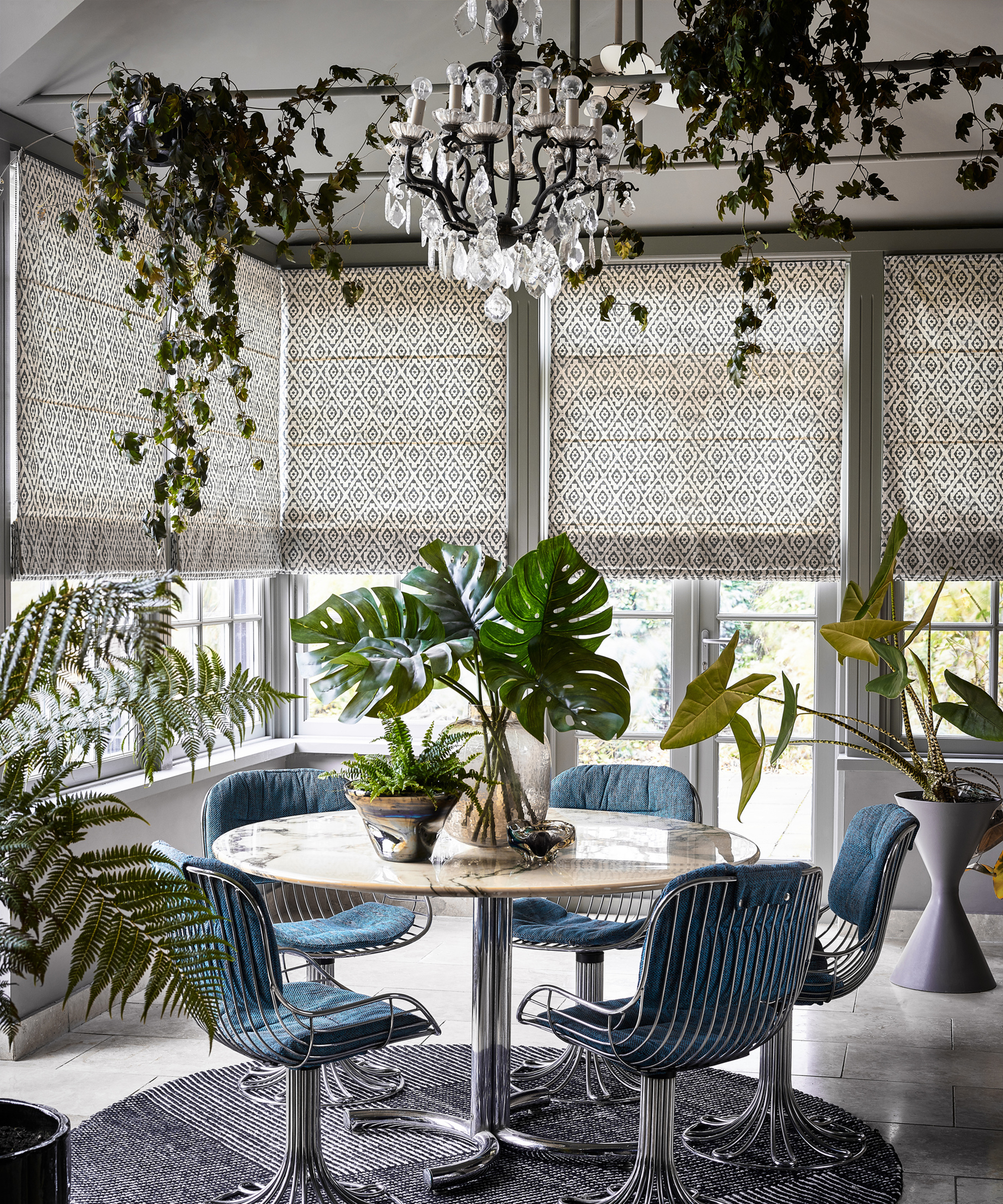Thomas Sanderson Izmir Roman Blinds in Dining Room with palm plants and Ivy