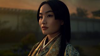 A close-up of a woman looking into the distance during the Hulu show, Shogun.