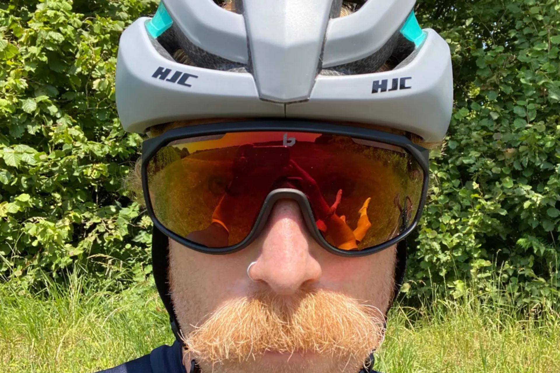 Image shows a rider wearing the Bolle Chronoshield cycling sunglasses