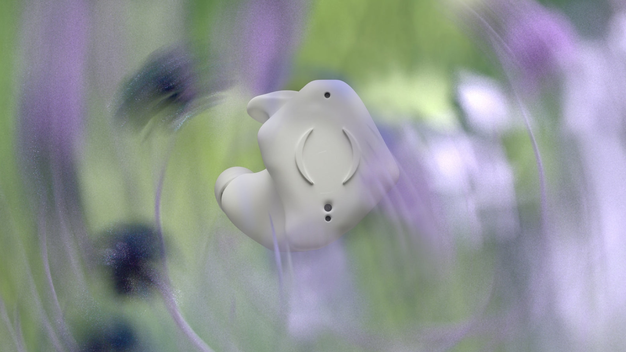 Breggz Zohn-1 RTW earbud in white against a blurry lilac, white and green background