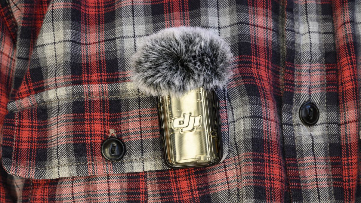 DJI Mic 2 receiver attached to a shirt pocket using its magnet
