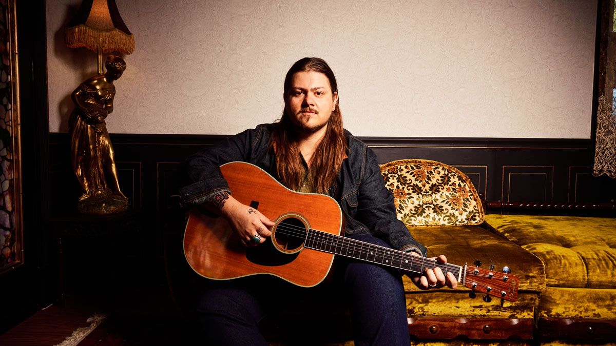 Vincent Neil Emerson and a Martin acoustic guitar