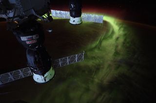Lime-green auroras shimmy over the South Pole in this view from the International Space Station. "Years ago at the South Pole, I looked up to the aurora for inspiration through the 6-month winter night," NASA astronaut Christina Koch tweeted from space. "Now I know they’re just as awe inspiring from above." In the foreground of the image, two Russian spacecraft are docked to the orbiting lab: the Soyuz MS-12 crew spacecraft and the Progress 72 cargo vessel.