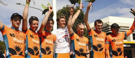 Genesys Wealth Advisers celebrates its teams classification victory with overall winner Ben Grenda in the white jersey.