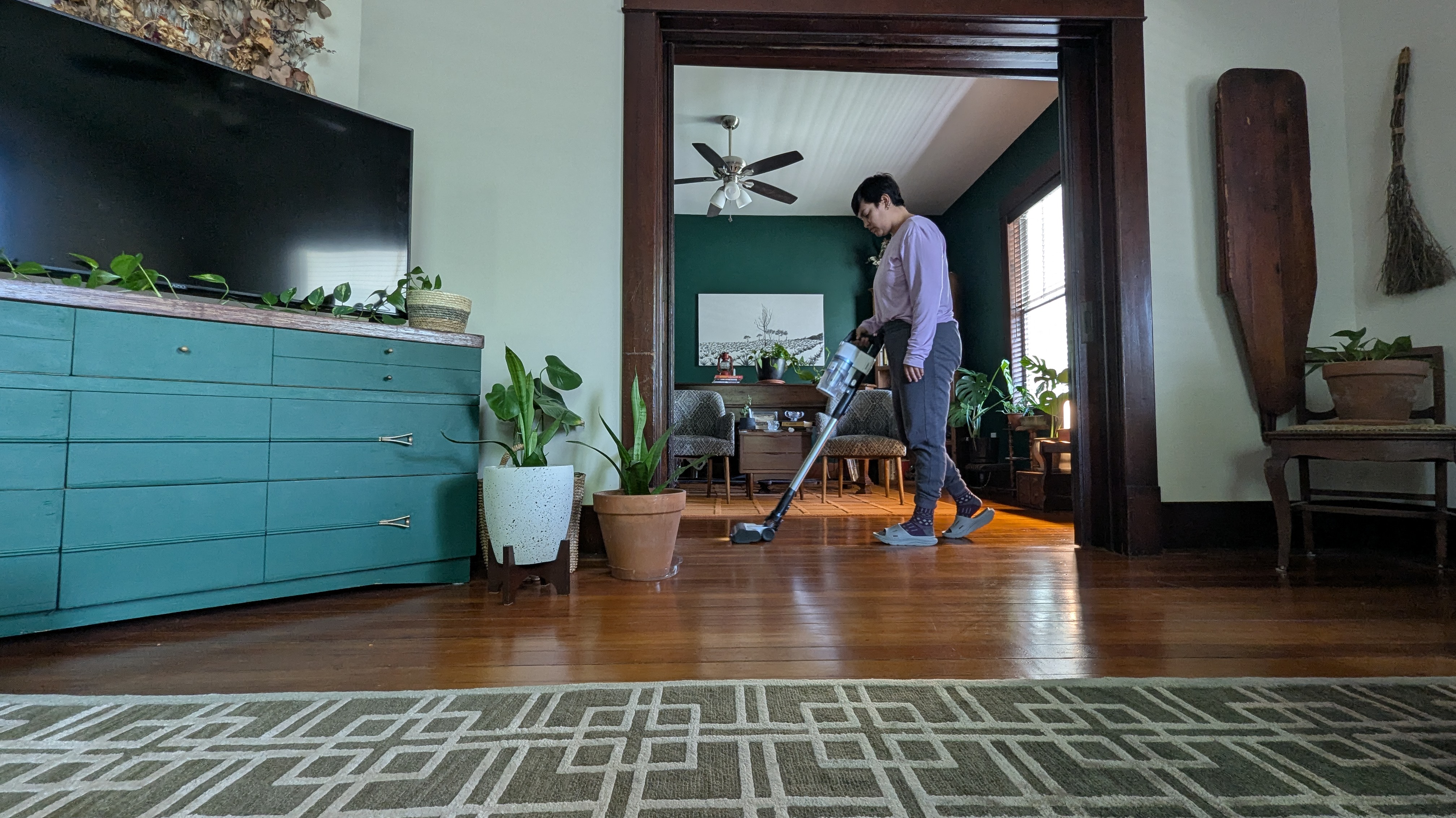 Reviewer using Levoit Aero vacuum to clean her living space