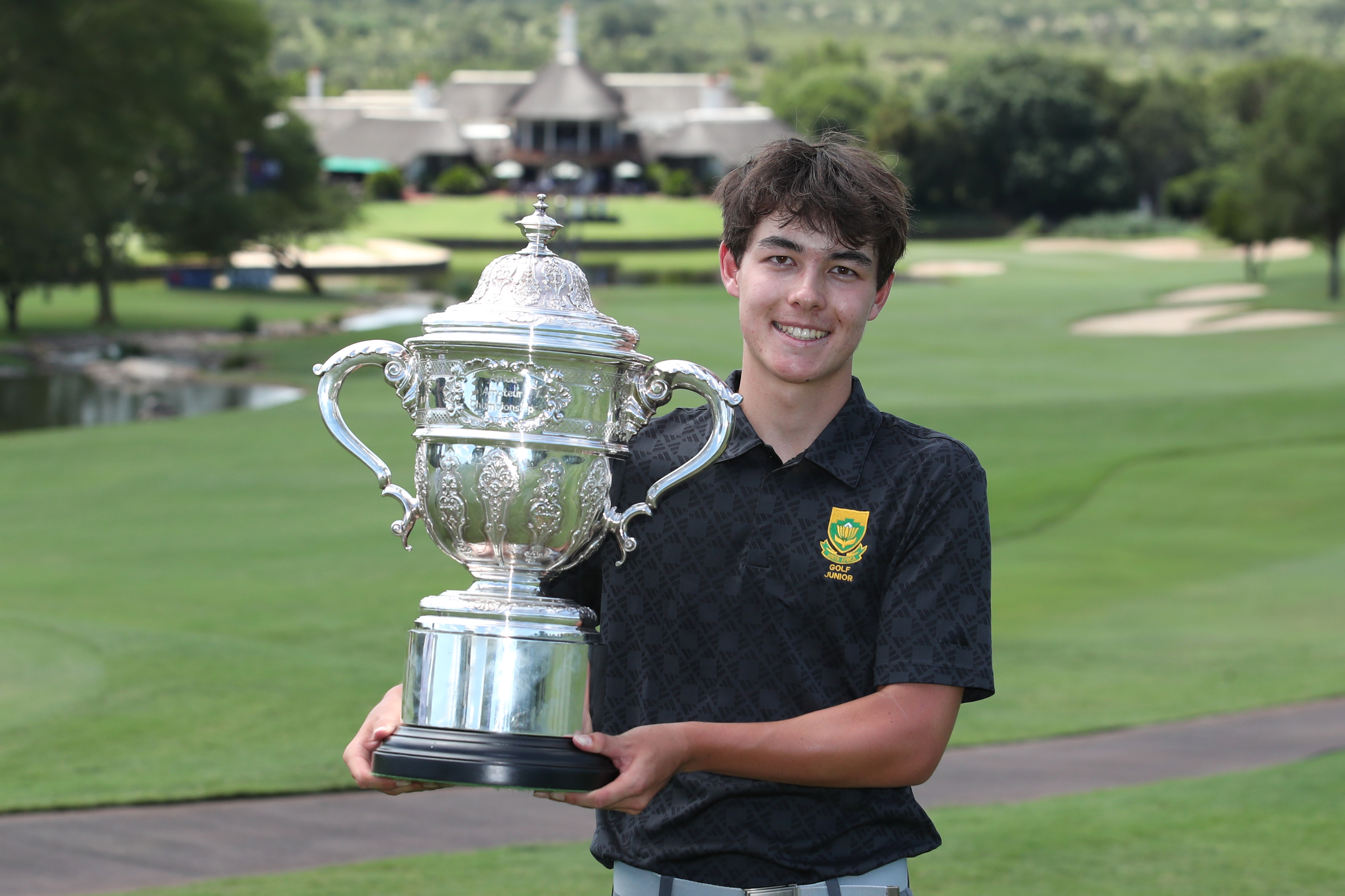 Bryan Newman holds the Africa Amateur Championship trophy