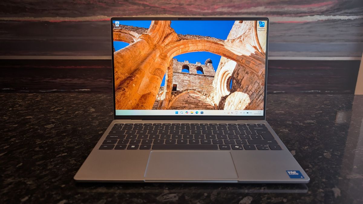 The Dell XPS 13 (2026) laptop pictured on a black marble worktop.