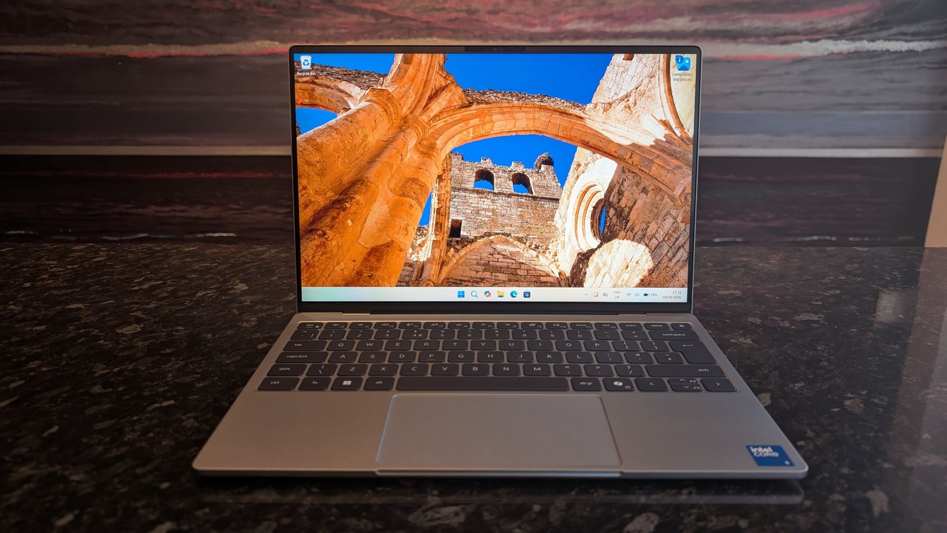 The Dell XPS 13 (2026) laptop pictured on a black marble worktop.