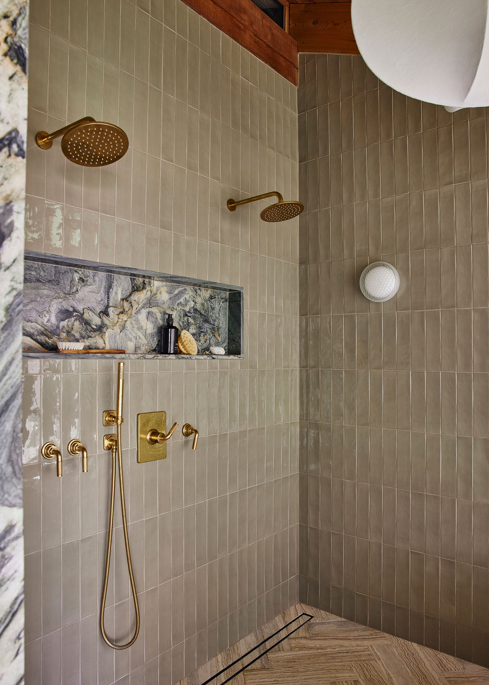 brass twin showers with fixed head showers and handheld shower