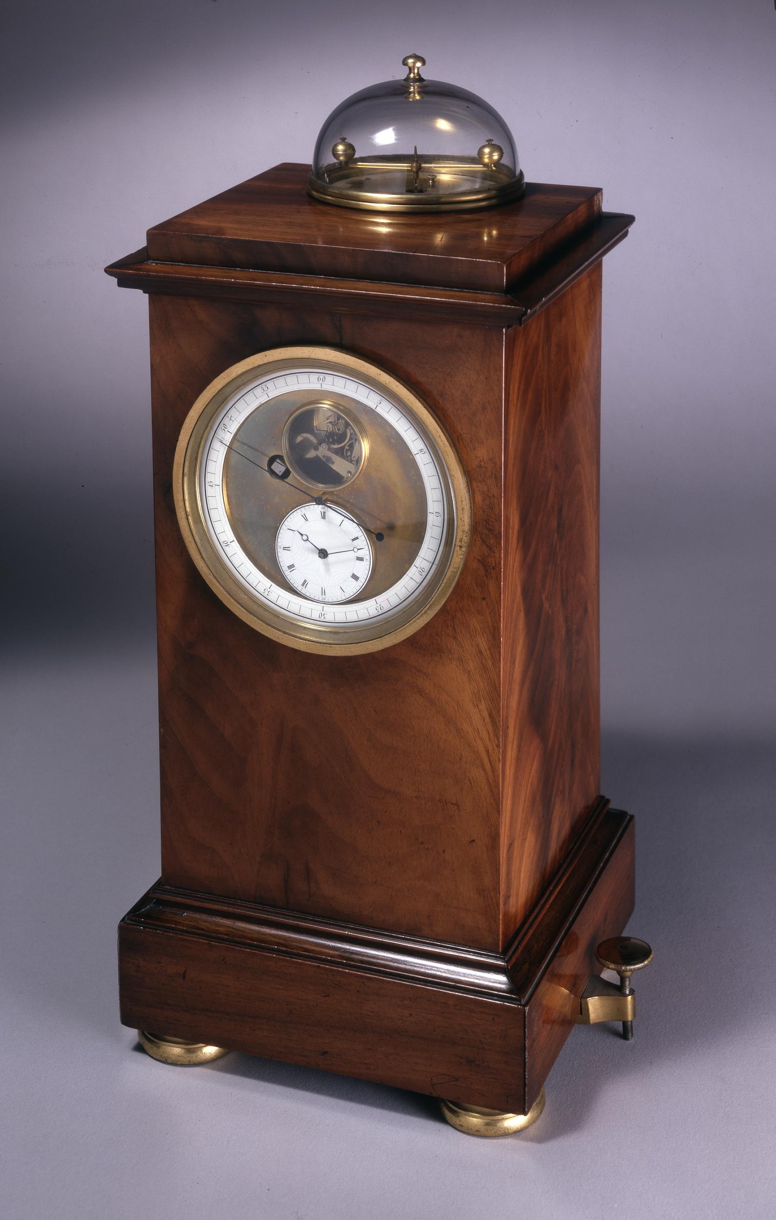 Squat astronomical clock in dark wood
