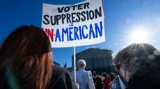 UNITED STATES - OCTOBER 15: Voting rights activists protest outside the U.S. Supreme Court as the court prepares to hear arguments in a case challenging Louisiana's congressional map in Washington on Wednesday, October 15, 2025. 