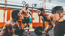 Michael Hutchinson superimposed into the corner of a gym image with men cheering each other on