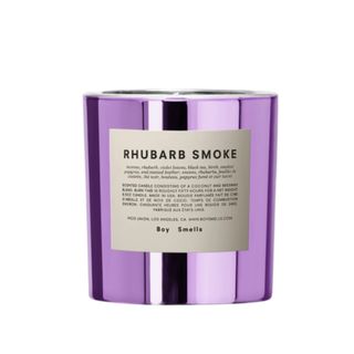 A purple candle with a label that says 'rhubarb smoke'