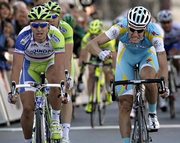 Stage 1 winner Peter Sagan cracks a smile while runner-up Jacopo Guarnieri punches his bars in anger.
