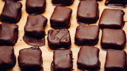 Caramel fudge squares coated in chocolate