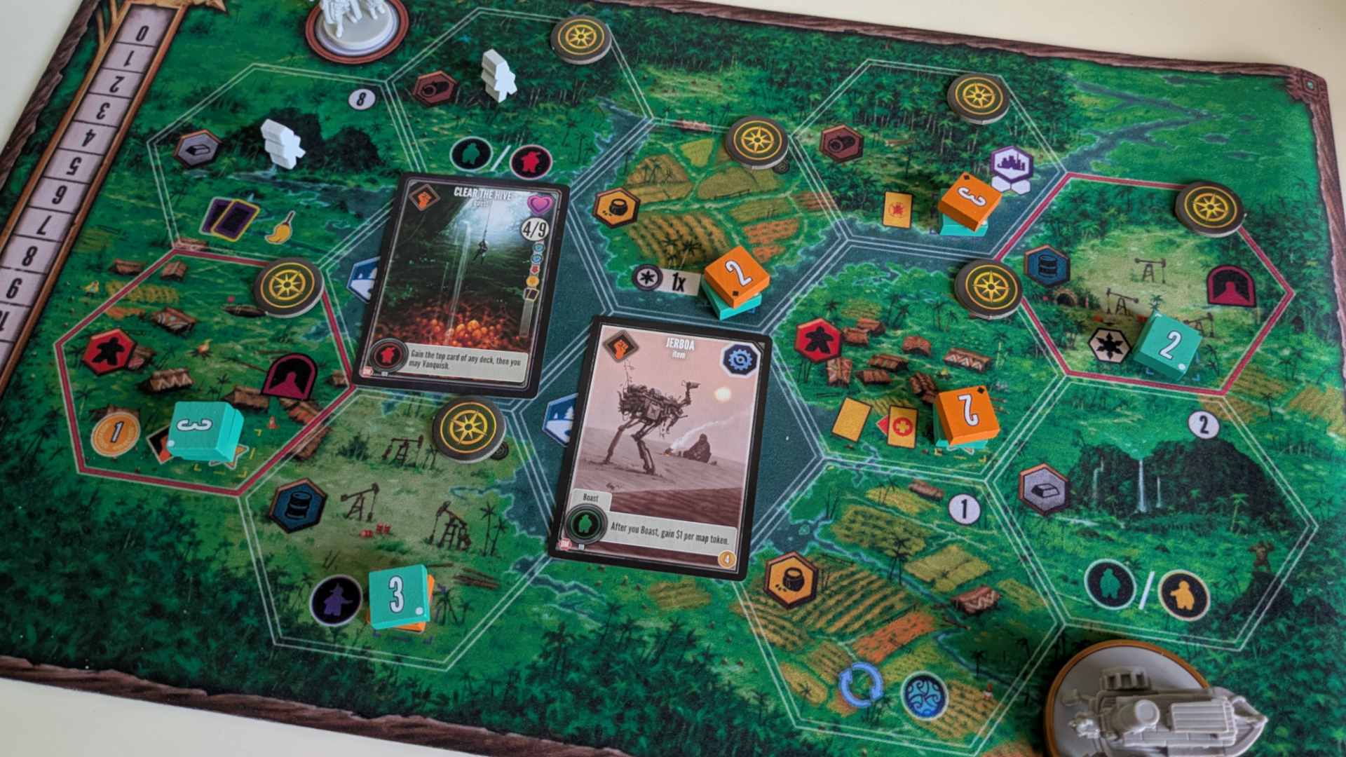 Duel of Meloch cards, tokens, and miniatures on the board