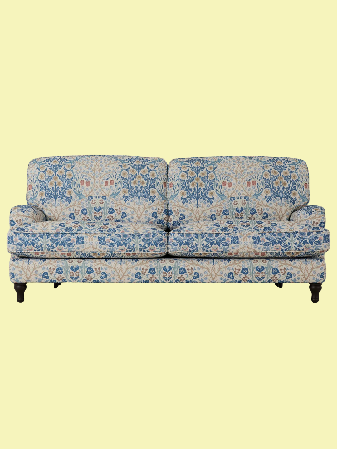A blue and amber patterned sofa from Swyft x Morris &amp;amp; Co.