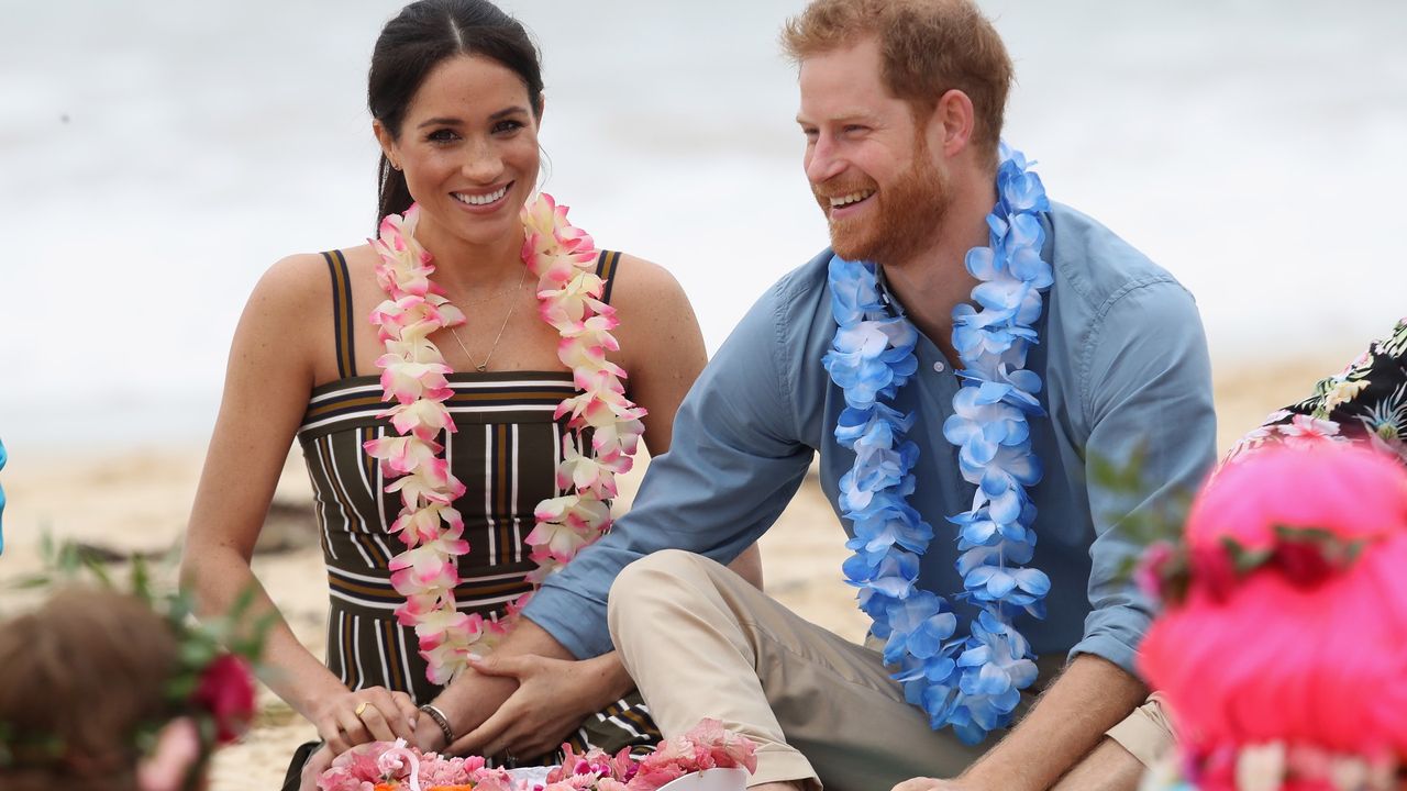 Prince Harry, Duke of Sussex and Meghan, Duchess of Sussex talk to members of OneWave, an awareness group for mental health and wellbeing at South Bondi Beach on October 19, 2018 in Sydney, Australia. The Duke and Duchess of Sussex are on their official 16-day Autumn tour visiting cities in Australia, Fiji, Tonga and New Zealand.