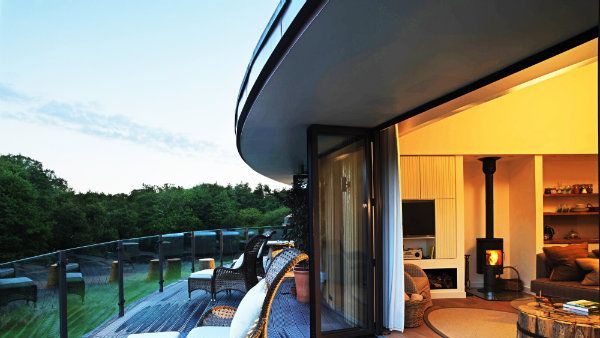 Real estate, House, Home, Door, Shade, Couch, Houseplant, Bridge, Wood flooring, Coffee table,