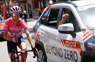 Team Treks Spanish rider Juan Pedro Lopez wearing the overall leaders pink jersey seeks sun cream from the medical car during the 10th stage of the Giro dItalia 2022 cycling race 196 kilometers between Pescara and Jesi central Italy on May 17 2022 Photo by Luca Bettini AFP Photo by LUCA BETTINIAFP via Getty Images