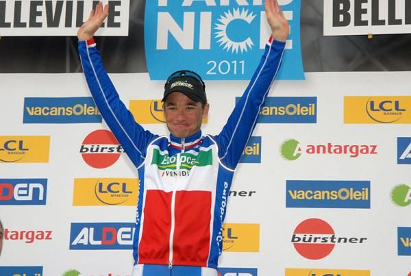 French champion Thomas Voeckler (Europcar) celebrates his stage win on the podium.