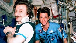 Mir-23 flight engineer Aleksandr Lazutkin and Michael Foale in the Base Block module.