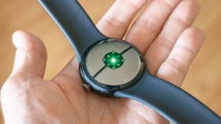 The rear health sensors on the Pixel Watch 3 glowing green