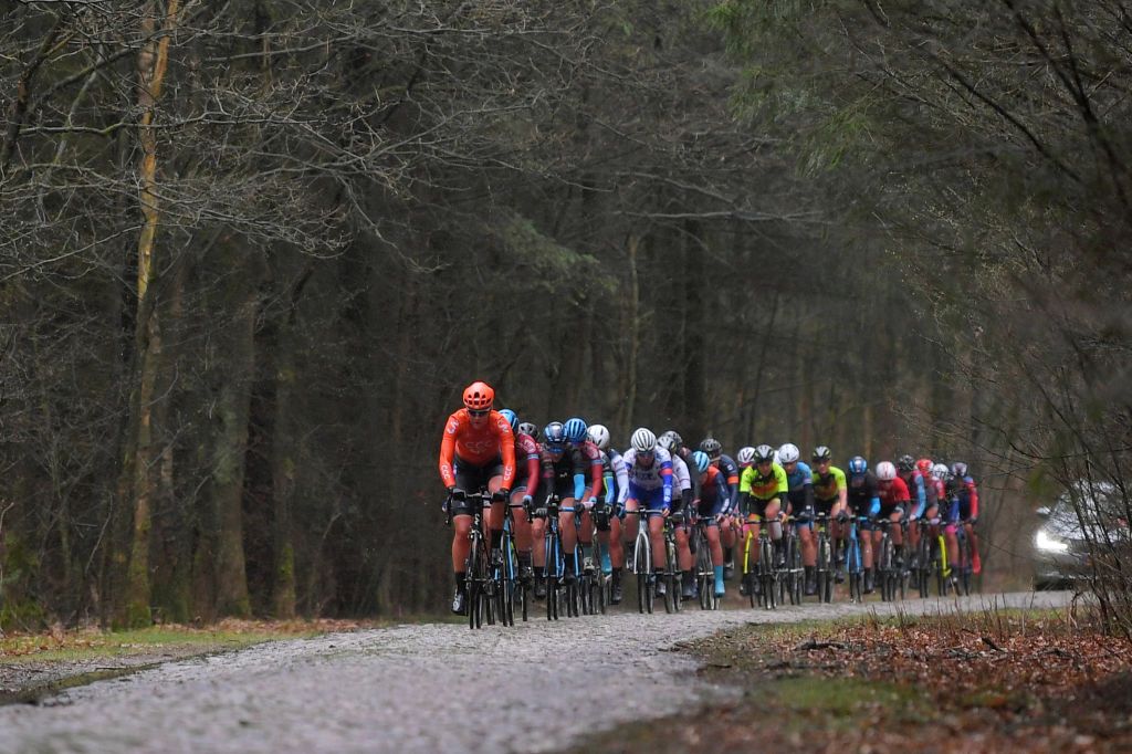 The riders make their way across one of the cobbled sectors