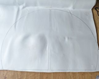 Upholstery foam with two semi-circle segments drawn in pen