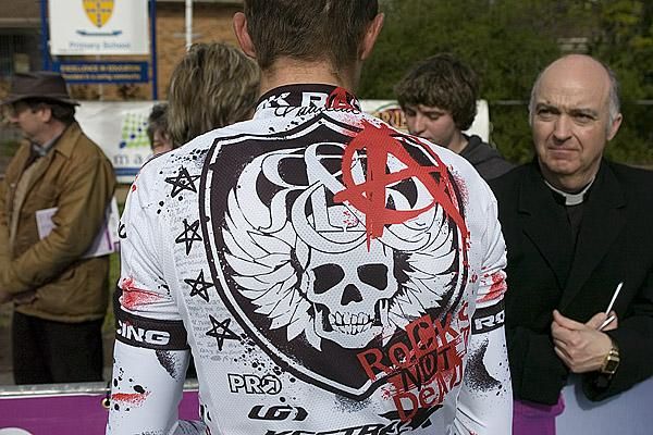 Bless you my son, for Rock's well and truly not dead. Rock Racing rider David Tanner gets a blessing before the start.